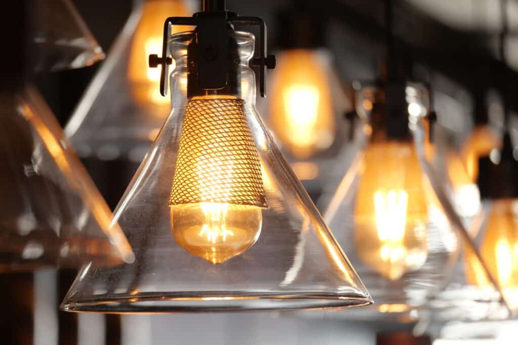 Warm glow of hanging glass light fixtures in a modern home upgrades space