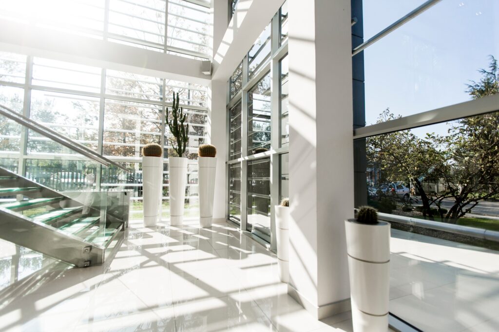 Modern office building with large glass windows and clean architectural lines, ideal for a renovated accounting firm space.